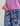 Purple hoodie with drawstring waist paired with abstract tie-dye shorts in purple, blue, and black tones.