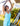 Huk women's Bayside Romper in Caicos Heather, 4-way stretch dress, lifestyle photo on the water