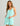 Huk women's Bayside Romper in Caicos Heather, 4-way stretch dress, front view, alternate angle