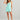 Huk women's Bayside Romper in Caicos Heather, 4-way stretch dress, back view