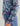 Women's hoodie with multicolor abstract print in pink, blue, and black with text graphic on sleeve and drawstring hem.