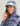 Women's hoodie in purple, pink, and blue tie-dye fish print with teal visor and white front panel.