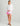 Huk women's Tide Point Oversized Shirt in White, stretch performance fishing shirt, back view