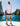 Huk women's Tide Point Oversized Shirt in Oleander, moisture-wicking performance fishing shirt, worn on the water