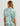 Huk women's Women Breezeway Camp Shirt in Heron Blue Conch Shell, button-down fishing shirt, side view