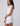 Huk women's Isla Dress in White, UPF 30+ sun protection dress, side profile view