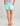 Huk women's Pursuit Volley Swim Short in Caicos Sea Spray, 4-way stretch fishing shorts, side view