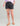 Huk women's Cruiser Short in Volcanic Ash, stretch fishing shorts, front view, alternate angle