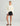 Huk women's Isla Short in Black, quick-drying fishing shorts, back view