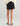 Huk women's Isla Short in Black, moisture-wicking fishing shorts, side view