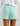 Huk women's Isla Short in Caicos, moisture-wicking fishing shorts, side view