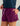 Purple shorts with drawstring waist and side pockets, worn with navy blue top.