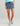 Huk women's Embark Skort in Vintage Indigo, UPF 50+ sun protection fishing bottoms, front view, alternate angle
