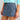 Huk women's Embark Skort in Vintage Indigo, UPF 50+ sun protection fishing bottoms, front view