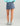 Huk women's Embark Skort in Vintage Indigo, stretch fishing bottoms, side profile view