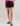 Huk women's Embark Short in Black, stretch fishing shorts, front view, alternate angle