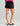 Huk women's Embark Short in Black, UPF 50+ sun protection fishing shorts, side profile view