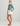 Huk women's Embark Short in Egret, stretch fishing shorts, back view