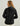 Black women's hooded jacket with gray inner collar shown from back view.