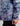 Women's jacket with purple, teal, and black abstract storm print pattern and center front zipper.