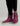 Pair of burgundy and gray pull-on boots with striped calf panels and white platform soles.