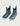 Women's Huk Rogue Wave boots in blue with wave print, white sole, and pull tabs.