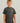 Child wearing charcoal gray t-shirt with yellow shark outline graphic on chest.