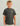 Child wearing charcoal gray t-shirt with yellow shark outline graphic on chest.