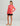 Huk youth Girls Pursuit Performance Hoodie in Neon Coral, vented long-sleeve fishing hoodie, back view