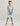Boy wearing light blue camo hoodie with HGK logo and matching turquoise shorts.