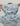 Kids hoodie in light blue and mauve camouflage pattern with drawstring and front logo text.