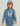 Child wearing blue camo hoodie with white Huk logo on chest and sleeve text.
