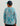 Child wearing turquoise and coral patterned long-sleeve crew neck shirt with matching turquoise and navy baseball cap, shown 