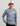 Child wearing gray and blue camo performance crew neck long-sleeve shirt with circular logo patch.