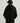 Child wearing black cotton fleece hoodie with drawstring hood, shown from back view.