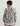 Child wearing a camouflage patterned 1/4 zip fleece pullover in gray, black, and yellow, viewed from the back.