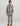 Child wearing camouflage fleece 1/4 zip pullover in yellow and gray with gray pants.