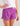 Purple swim shorts with white drawstring tie and side vent detail, paired with white t-shirt.