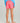Huk youth Girls Pursuit Volley Swim Short in Neon Coral, 4-way stretch fishing shorts, back view