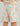 Kids swim shorts with turquoise, coral, and tan beach-themed print including dinosaurs, water, and starfish patterns.