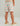 Kids swim shorts with coral, teal, and tan beach-themed print, elastic waistband, and side pocket.