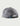 Gray mesh trucker hat with white front panels and black snapback closure, shown from back angle.