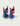 Pair of pull-on boots with red cuffs, blue ankle sections, white soles, and striped handles in red, white, and blue.