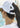 Huk women's Ponytail Hat in White, fishing cap, studio product photo