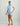 Women's light blue v-neck tee with small yellow chest logo and short sleeves.