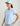 Light blue women's v-neck tee with small yellow and white graphic logo on chest.